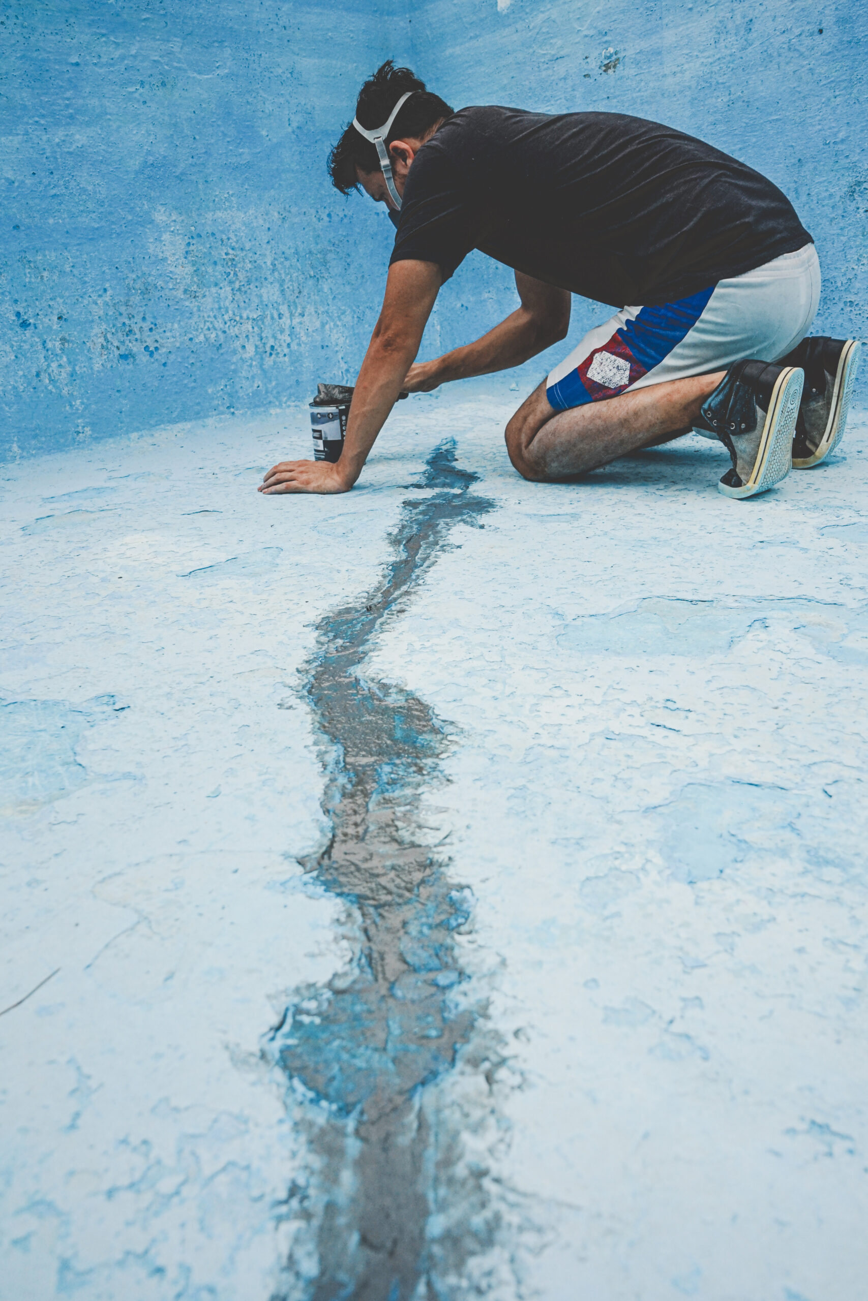 Young man working in his swimming pool